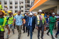 Bawumia receiving cheers from some people as he takes a walk with Lydia Alhassan and Adutwum