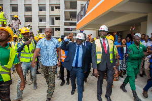 Bawumia receiving cheers from some people as he takes a walk with Lydia Alhassan and Adutwum