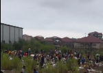 Watch as residents rush to collect goods swept away by floodwaters