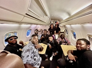 Bisa Kdei with his crew in a private jet