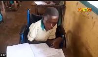 Yussif Toyombo taking one of his BECE papers on Monday