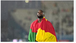 Emmanuel Eseme, of Cameroon, reacts after winning the gold medal in the men's 100 meters final