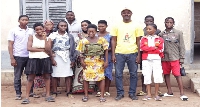 Pastor Aho (in cap) in a pose with some of the rescued children