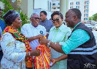Lordina Mahama presenting hampers to retired pastors and widows