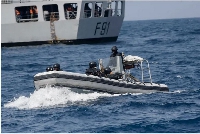 Nigerian naval special forces patrol during a navy exercise with the United States