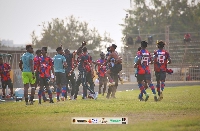 Legon Cities players celebrates with the technical bench