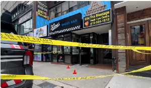 Kiva's Bagel Bar in Toronto is blocked off after it was damaged on July 26