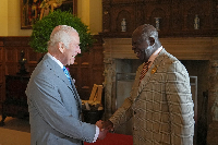 King Charles and Otumfuo Osei Tutu II exchanging a handshake