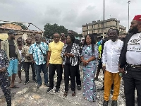 Prof Naana Jane, Nii Ashie Moore and some other executives at the site of the fire CMB