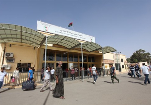 Libyans walk toward the departure hall in Benghazi airport