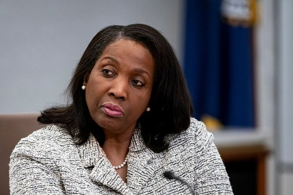 Lisa Cook listens during an open meeting of the Board of Governors at the Federal Reserve