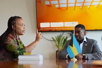 Mavis Kuukua Bissue (L) and Barry N. Griffin (R) during the meeting