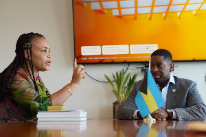 Mavis Kuukua Bissue (L) and Barry N. Griffin (R) during the meeting
