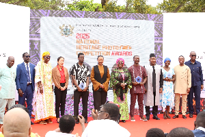 Dzifa Gomashie (In green cloth) with some officials at the National Heritage Photo Awards