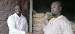 Emmanuel Armah-Kofi Buah in a handshake with a constituency member