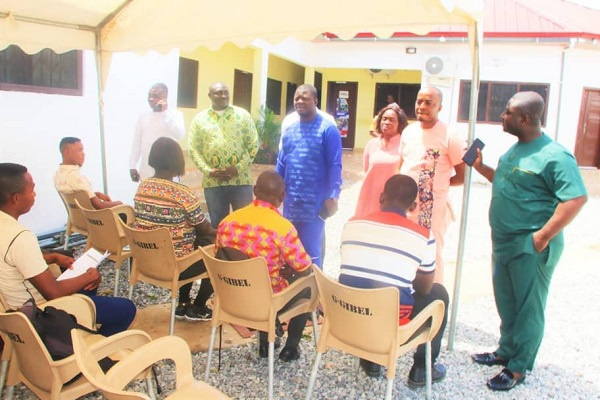 Kofi Baah Agyepong with some beneficiaries