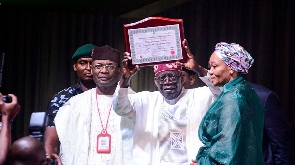 Nigeria's President-elect Bola Tinubu after receiving his election certificate from INEC