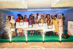 Winners of the Access Bank Pitch-a-ton displaying their cash prices and mini-MBA certificates
