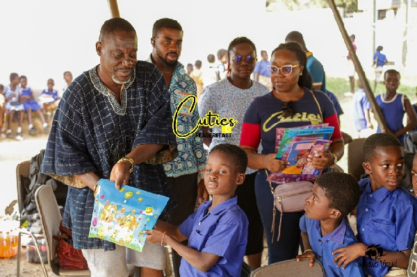 Members of Cuties Readerfeast Foundation with the pupils of Berekuso schools at the event held on We