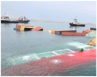 Cargo seen floating in the water after a Tanzanian vessel capsized