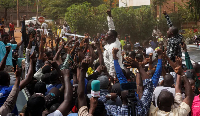 Pro-democracy youth leader Cheick Oumar , (C), chants slogans surrounded by supporters protesting