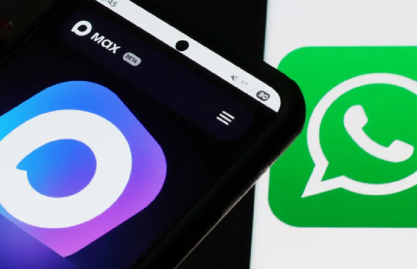 Russian messenger app MAX is displayed on a smartphone next to the WhatsApp logo