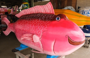A decorative fish-shaped coffin, crafted by Eric Kpakpo Adotey, is on display