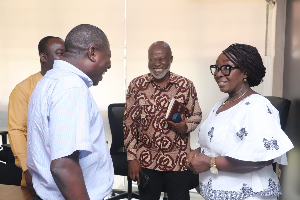 Dzifa Gomashie interacting with the management of the ministry on her first day at work as minister