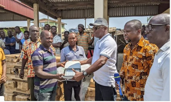 The MCE Abdul Issah donating streetlights to combat crime in the area