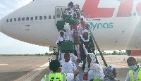 Pilgrims disembarking from the aircraft