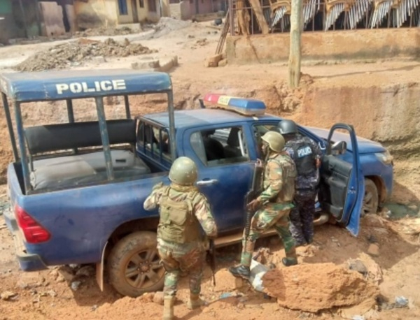 An abandoned police vehicle at the site of the clash