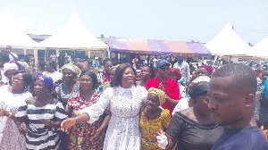The MP of Mfantseman Constituency, Ophelia Mensah Hayford with some widows at the event