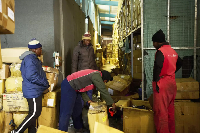 Workers load final clothing boxes at a Lesotho factory