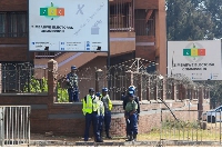Police guard the offices of the Zimbabwe Election Commission as vote counting continues