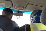 Outrage as police officer, driver captured fighting while car is in motion