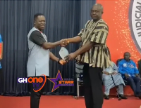 Murtala (left) recieving the award for Best Court Reporter