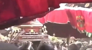 The casket of Otumfuo Opoku Ware II being carried shoulder-high