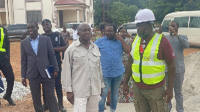 The Ashanti Regional Minister (L) speaking to a contractor at one of the sites