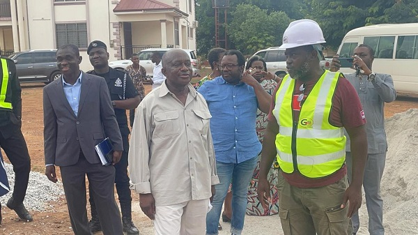 The Ashanti Regional Minister (L) speaking to a contractor at one of the sites