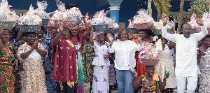 Ghana Gas CEO Adjobah Blay in white with the widows