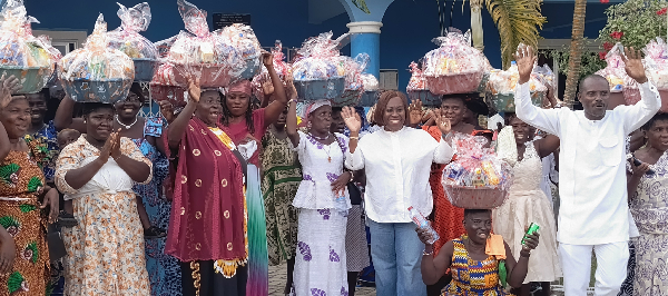 Ghana Gas CEO Adjobah Blay in white with the widows