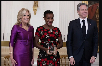 Agather Atuhaire, centre, of Uganda receiving the International Women of Courage (IWOC) Award