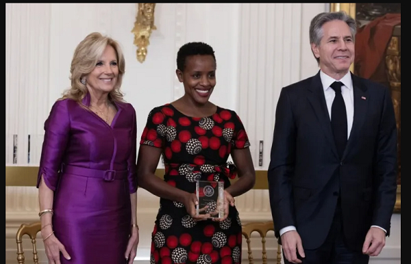 Agather Atuhaire, centre, of Uganda receiving the International Women of Courage (IWOC) Award