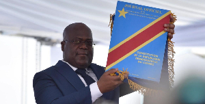 Felix Tshisekedi Holds Up The Constitution .png