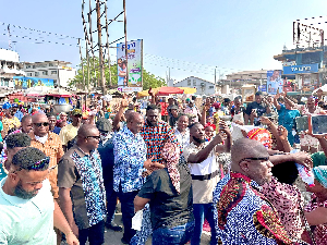 Alan Kyerematen with his team when they visit the Kantamanto Market