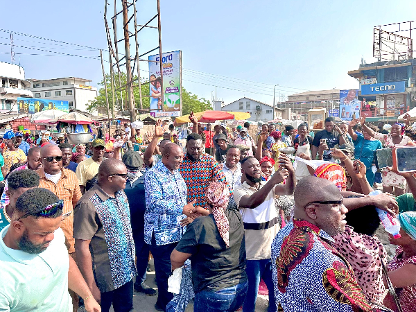 Alan Kyerematen with his team when they visit the Kantamanto Market