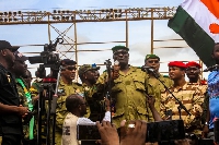 Members of a military council that staged a coup in Niger attend a rally at a stadium in Niamey