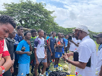 Coach JE Sarpong speaking to some of the players