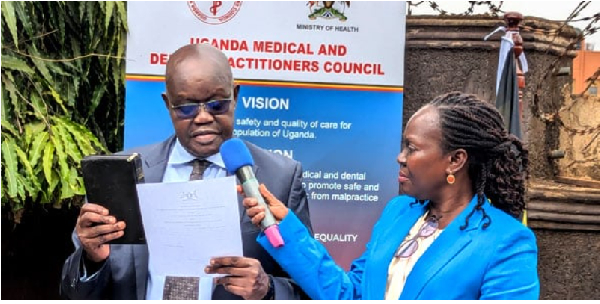 Prof Joel Okullo, the UMDPC chairperson takes oath during the swearing in ceremony in Kampala