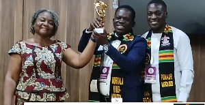 Murtala Kwei-Nortey Inusah (M) expressed heartfelt gratitude to IPLS for the award